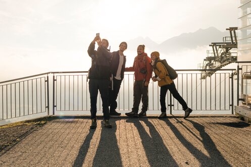 Friends take a selfie while hiking at Arlberg