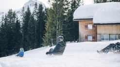 Tobogganing fun with the whole family at the toboggan run Oberlech