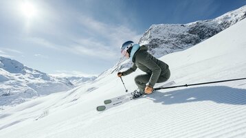Skier on freshly prepared slopes