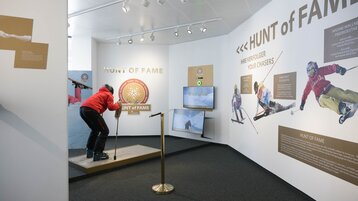 Skier on the ski simulator in the Hall of Fame