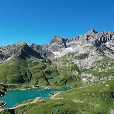 Green hills and a clear lake at Seekopf nature mountain.