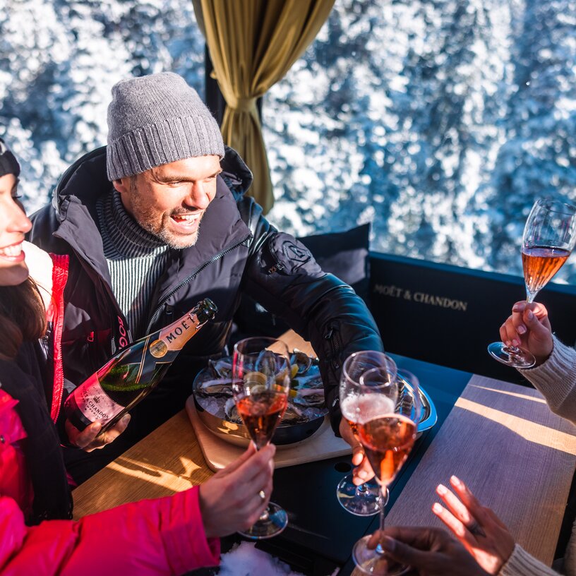 Group toasting with champagne in the gondola.