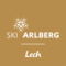 Logo: Ski Arlberg Lech auf goldfarbenem Hintergrund mit stilisiertem Schneekristall.