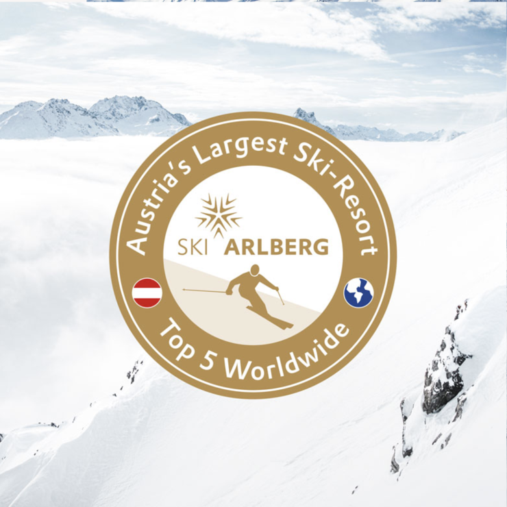 Logo des Ski Arlberg Resorts mit Ranginformationen: Größtes Skigebiet Österreichs, weltweit unter den Top 5.