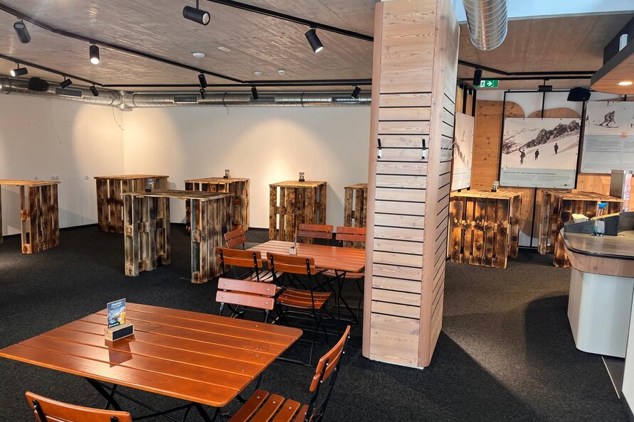 Bistro Rauz featuring rustic wooden tables and chairs.