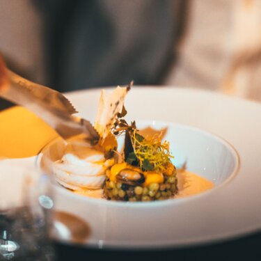 An elegant dish with fine details served in a stylish restaurant.