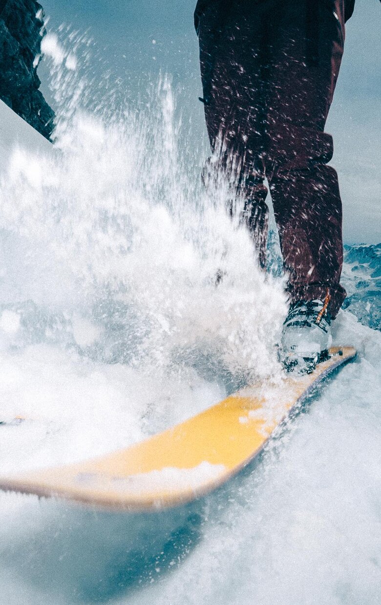 Close-up of a skier skiing in the snow.