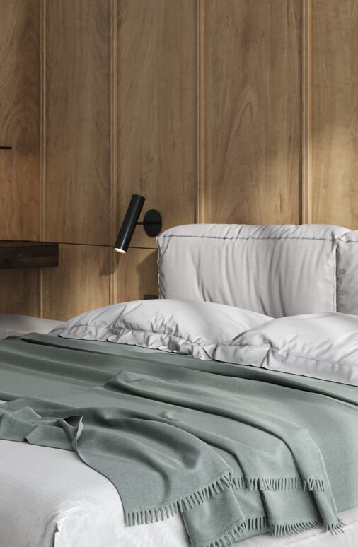 Cozy bedroom with wood wall, bed, and desk.