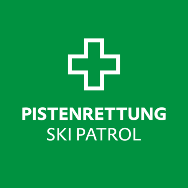 Green sign with a cross and the words Pistenrettung Ski Patrol.
